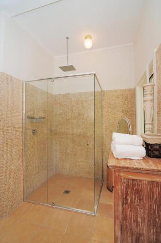 a glass shower in a bathroom with a sink at Love Shack 1 bedroom cosy cottage in Upper Kangaroo River