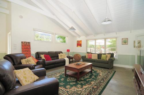 a living room with couches and a coffee table at Spring Grove Dairy Picturesque views in Upper Kangaroo River