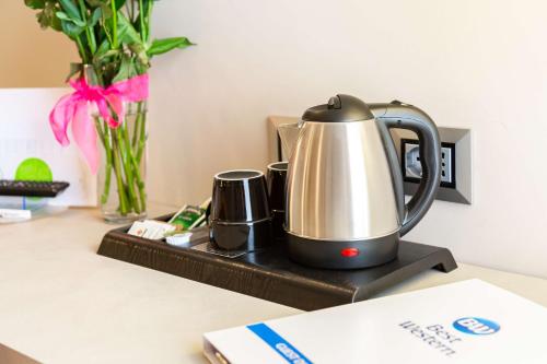 a coffee pot sitting on top of a counter at Best Western Hotel Imperiale in Nova Siri Marina