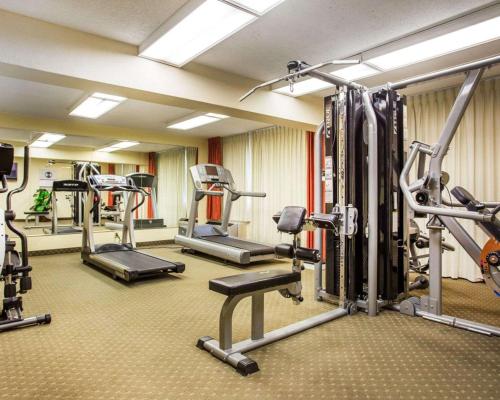 a gym with several tread machines in a room at Budgetel Inn & Suites Atlanta in Atlanta