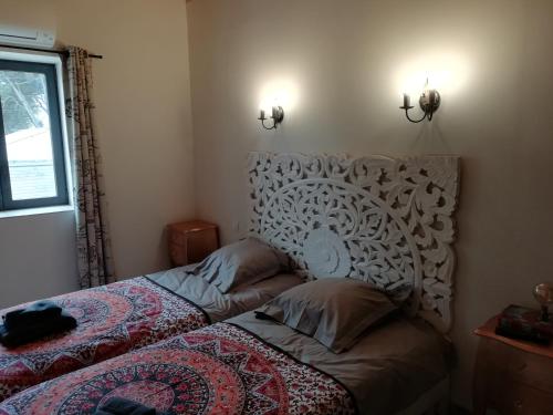 a small bedroom with a bed and a window at Domaine de la Vidalle in Vendres