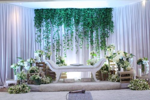 a room with a white table and some plants at Sabah Oriental Hotel in Kota Kinabalu