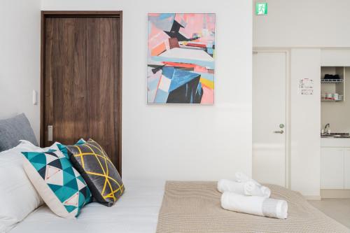 Ένα ή περισσότερα κρεβάτια σε δωμάτιο στο Hotel Apartment Ueno Inaricho Sta