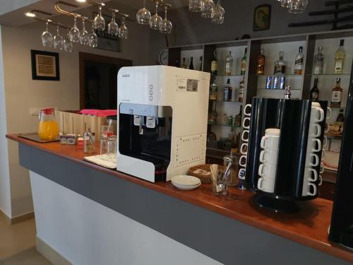 a coffee machine sitting on a counter in a coffee shop at Family Hotel Dayana Beach in Sinemorets