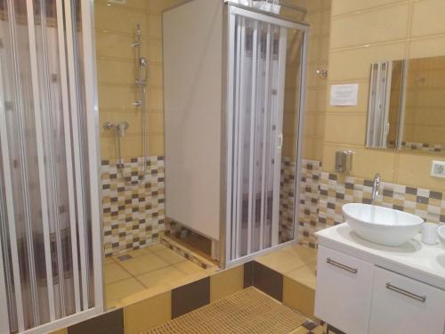 a bathroom with a sink and a shower at WOW Hostel in Moscow