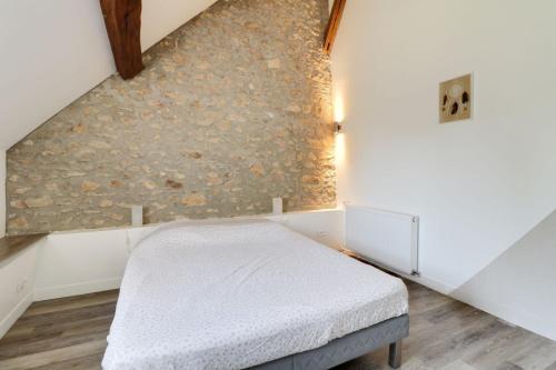 Postel nebo postele na pokoji v ubytování Domaine des Trois chateaux