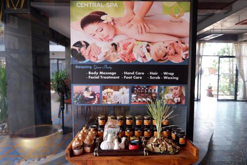 a sign for a spa with a group of bottles at Central Indochine D'angkor Hotel in Siem Reap