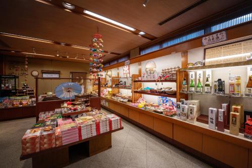 a grocery store aisle with a lot of products at Eirakukan in Koriyama