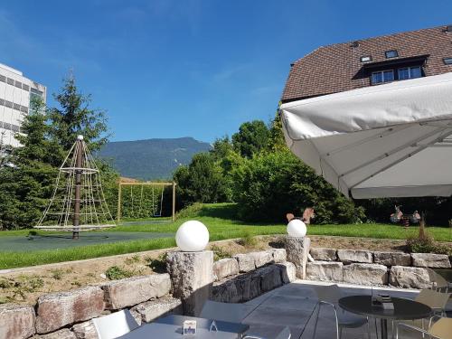 a patio with a table and a goal at Hotel Urs und Viktor in Bettlach