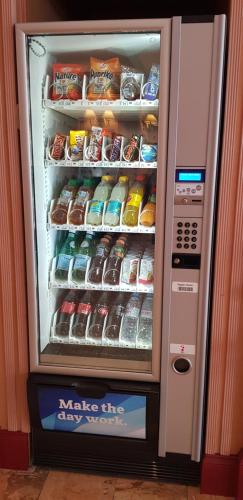 a refrigerator filled with lots of food and drinks at Hôtel Astoria in Geneva