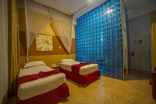 Postel nebo postele na pokoji v ubytování Eureka Place Hotel Kampala
