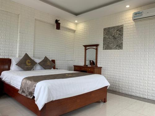 Un pat sau paturi într-o cameră la Chio Boutique Hotel