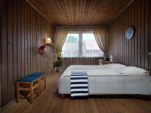 Ένα ή περισσότερα κρεβάτια σε δωμάτιο στο Zunda