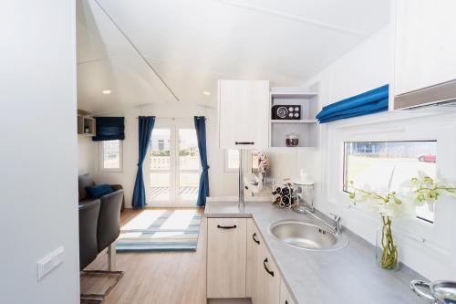 a kitchen with a sink and a counter top at Hotel Niedźwiadek in Wdzydze Kiszewskie