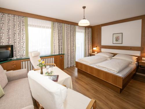 Postel nebo postele na pokoji v ubytování Pension und Appartement Weinschreiber
