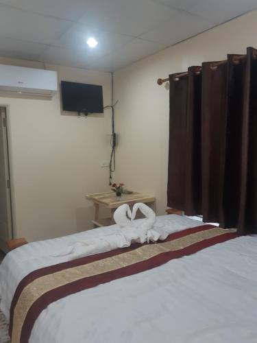 Katil atau katil-katil dalam bilik di Mae kuawn Resort