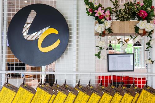 a row of yellow bags on a rack in a store at ibis Calais Car Ferry in Calais