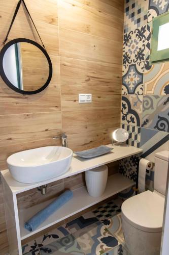 a bathroom with a sink and a mirror at Hostal Boutique Olvido 22 Adults Only in Peñíscola