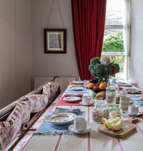 a dining room table with food on it at The Old Monastery Guesthouse in Cahersiveen