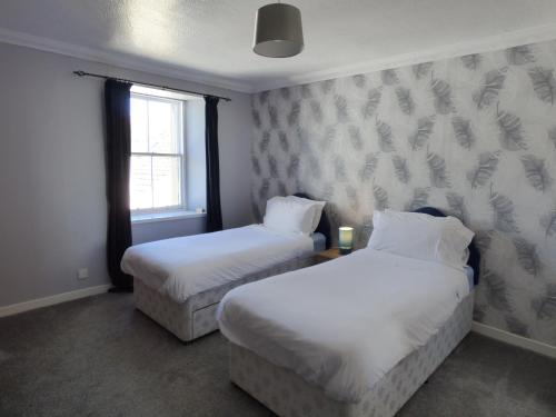 Postel nebo postele na pokoji v ubytování The Anchorage