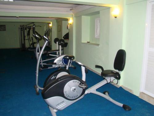 a gym with two exercise bikes in a room at Nazar Hotel in Didim