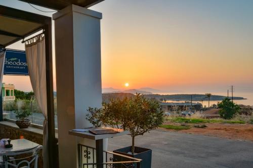 a sunset from the balcony of a house at Alexis Hotel in Chania Town