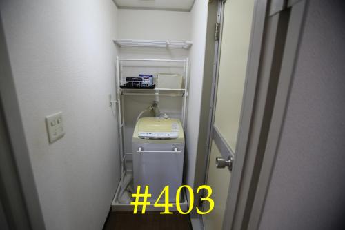 a small room with a machine in a room at マンションロアジス 大阪市東淀川区相川 in Osaka