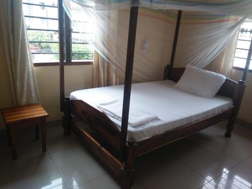 Postel nebo postele na pokoji v ubytování Cingaki Hotel