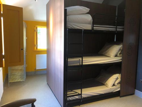 Bed in 9-Bed Mixed Dormitory Room with Shared Bathroom