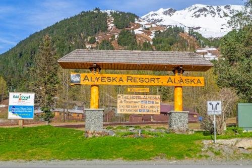 a sign for a ski resort in the mountains at Brighton #107 - 1 Bath Studio Apartment in Alyeska in Girdwood