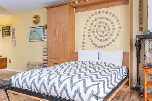 a bedroom with a zebra print bed in a room at Brighton #107 - 1 Bath Studio Apartment in Alyeska in Girdwood