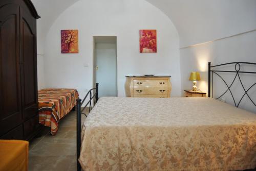 En eller flere senger på et rom på Villetta Gessica
