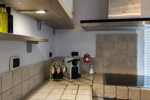 a kitchen with a stove and a counter top at Apartment Sebastijan in Piran