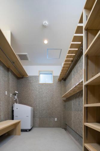 a large room with a sink and shelves at Hakuba White Fox Chalet - Echoland Central in Hakuba