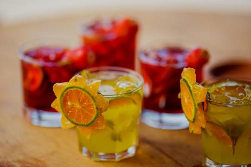 a group of three glasses with oranges and sangria at Santa Rosa Pantanal Hotel in Pôrto Jofre