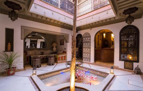 a large room with a swimming pool in a building at Riad L'Evidence in Marrakech