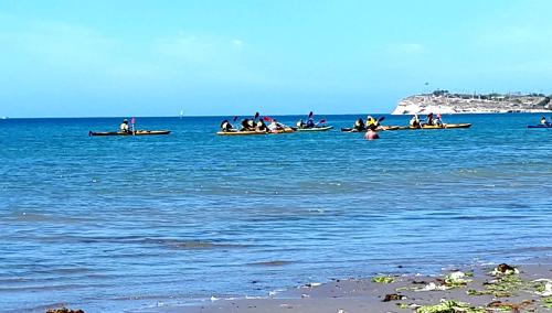 a group of people in boats in the water at Alem in Puerto Madryn