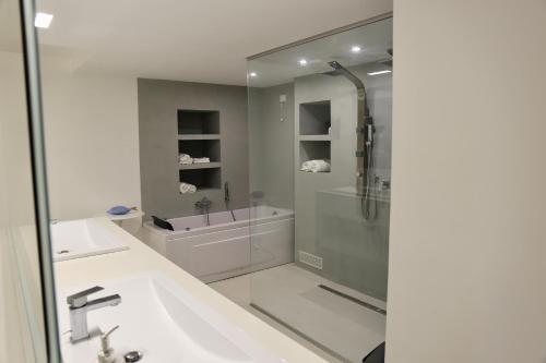 a bathroom with a shower and a sink at Acquabianca in Aci Castello