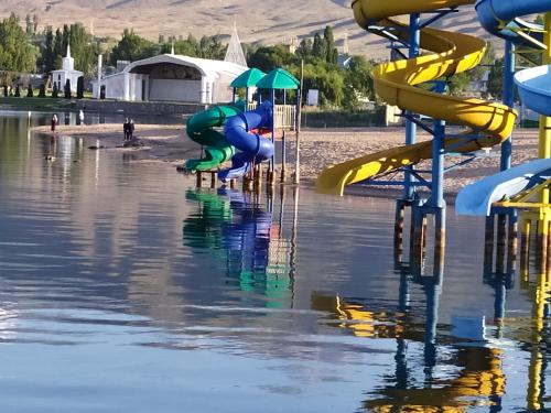 a water park with slides in the water at Boomerang Guest house in Cholpon-Ata