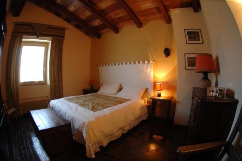 Ein Bett oder Betten in einem Zimmer der Unterkunft Mirabilia