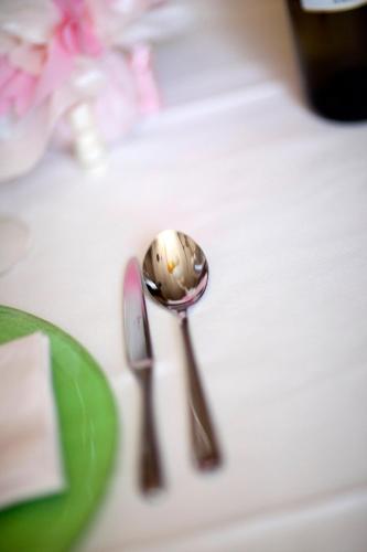 a spoon and knife sitting on top of a table at Agriturismo Pozzuolo in Serrungarina