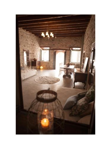 a living room with a couch and a table at Latmos 1860 in Skala