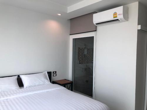Ένα ή περισσότερα κρεβάτια σε δωμάτιο στο Richmond Nan Hotel