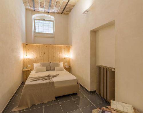 Ένα ή περισσότερα κρεβάτια σε δωμάτιο στο Balbo Suite & Apartment - Lecce Selection