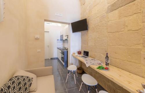 Μια τηλεόραση ή/και κέντρο ψυχαγωγίας στο Balbo Suite & Apartment - Lecce Selection