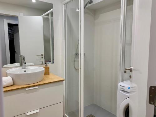 a bathroom with a sink and a shower at BPIRINEOS-Blest in Benasque