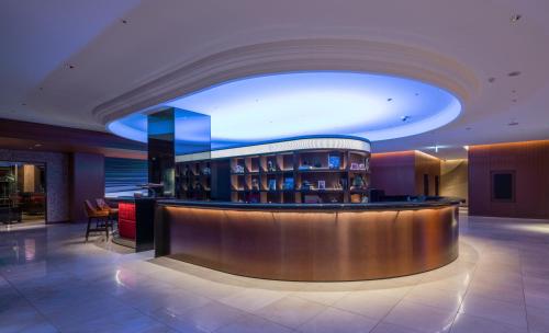 a lobby with a bar in a building at Hyatt Regency Tokyo Bay in Urayasu