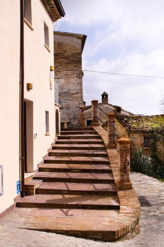 a set of stairs leading up to a building at Agriturismo Pozzuolo in Serrungarina