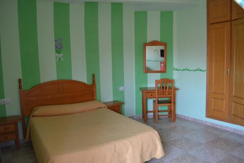 מיטה או מיטות בחדר ב-Hostal Vadillo