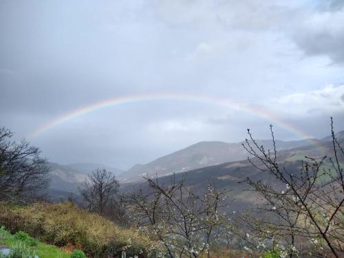 a rainbow in the sky over a mountain at Le Spine B&B sulla Via Francigena in Berceto